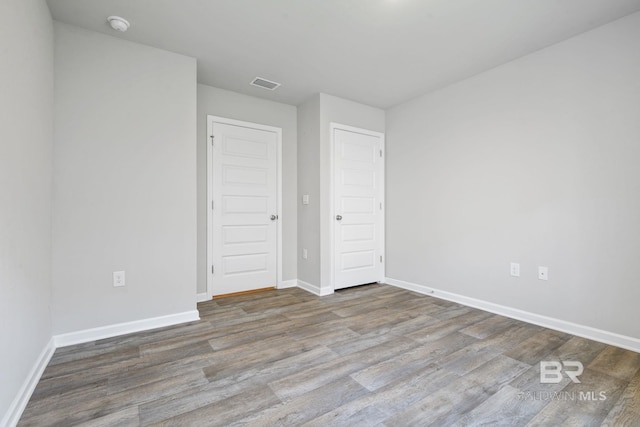 23159 Shadowridge Dr, Daphne, AL 36526 - unfurnished bedroom with wood finished floors and baseboards