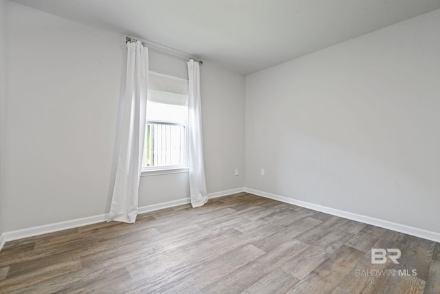 23159 Shadowridge Dr, Daphne, AL 36526 - unfurnished room with wood finished floors and baseboards