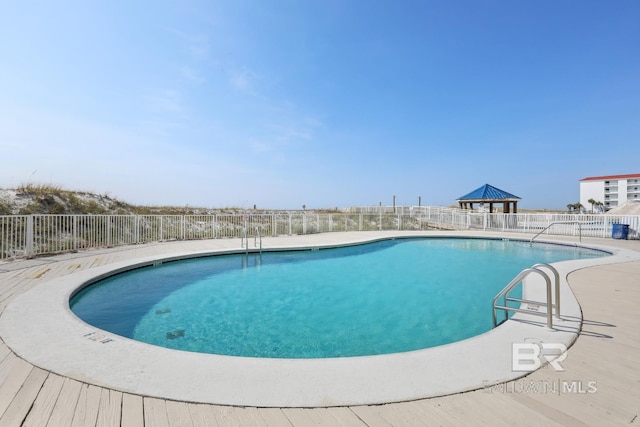 view of swimming pool featuring a patio area