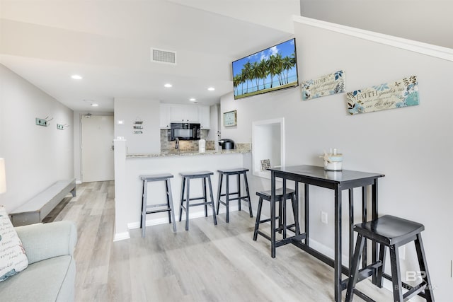 dining room featuring light hardwood / wood-style flooring