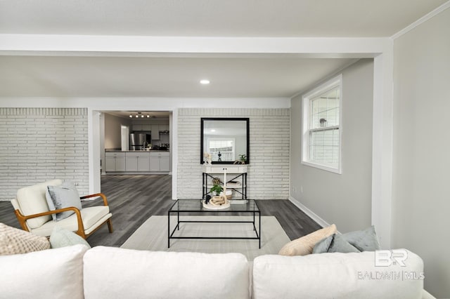 5922 Sunnyside Dr, Mobile, AL 36619 - living room featuring wood finished floors, baseboards, ornamental molding, brick wall, and recessed lighting