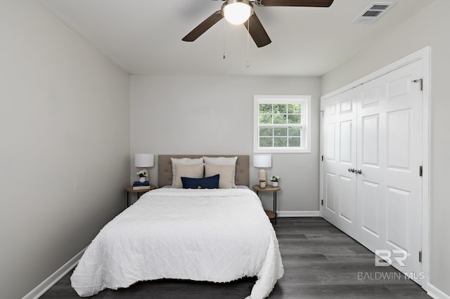 5922 Sunnyside Dr, Mobile, AL 36619 - bedroom with a closet, baseboards, dark wood-type flooring, and a ceiling fan