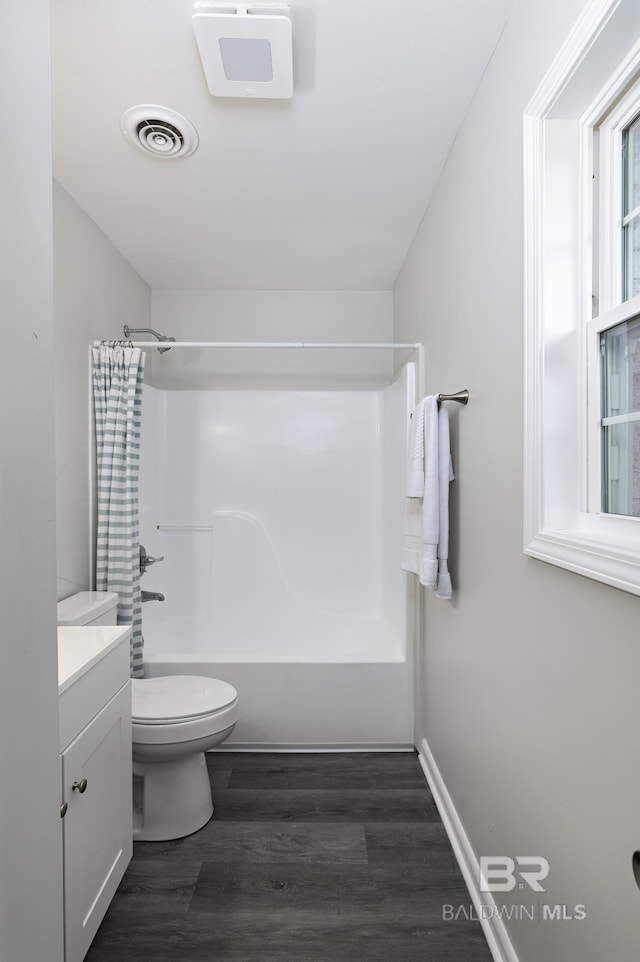 5922 Sunnyside Dr, Mobile, AL 36619 - full bathroom with wood finished floors, toilet, vanity, and bathing tub / shower combination