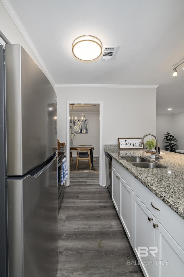 5922 Sunnyside Dr, Mobile, AL 36619 - kitchen with stainless steel appliances, a sink, crown molding, light stone counters, and dark wood finished floors