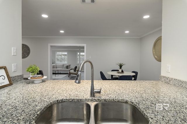 5922 Sunnyside Dr, Mobile, AL 36619 - kitchen with a sink, crown molding, stone countertops, and recessed lighting