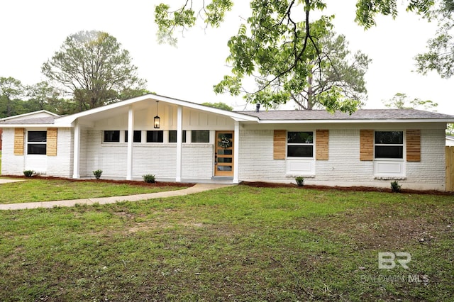 5922 Sunnyside Dr, Mobile, AL 36619 - view of front of property with brick siding, a front yard, and board and batten siding