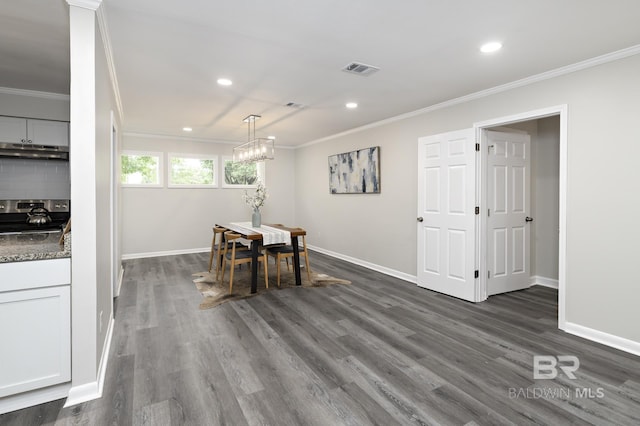 5922 Sunnyside Dr, Mobile, AL 36619 - dining room featuring crown molding, baseboards, dark wood-style floors, recessed lighting, and a chandelier