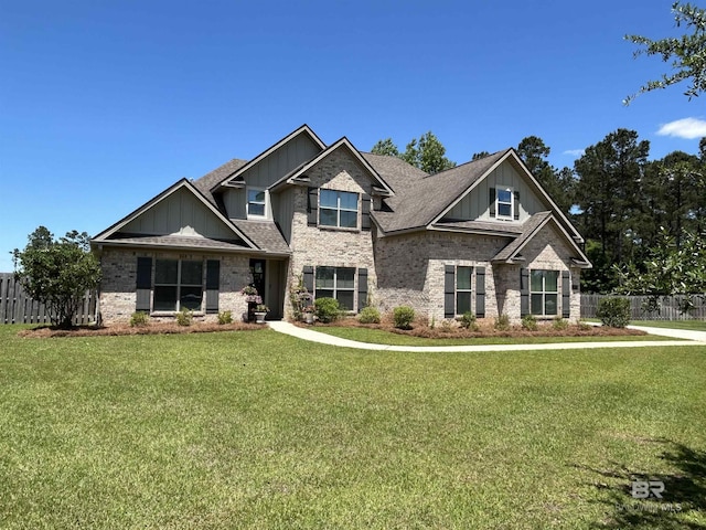 32035 Bobwhite Rd, Spanish Fort, AL 36527 - craftsman house featuring fence, board and batten siding, a front yard, brick siding, and roof with shingles
