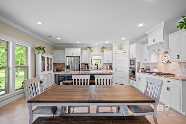 32035 Bobwhite Rd, Spanish Fort, AL 36527 - dining space with recessed lighting, light tile patterned flooring, and ornamental molding