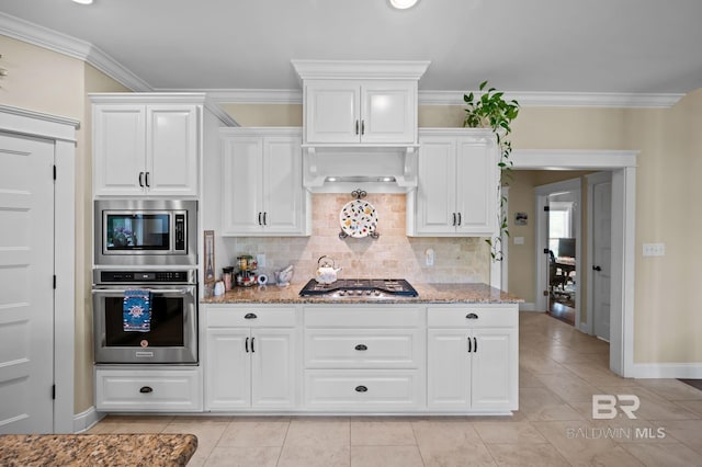 32035 Bobwhite Rd, Spanish Fort, AL 36527 - kitchen featuring stainless steel appliances, light stone counters, backsplash, light tile patterned flooring, and crown molding