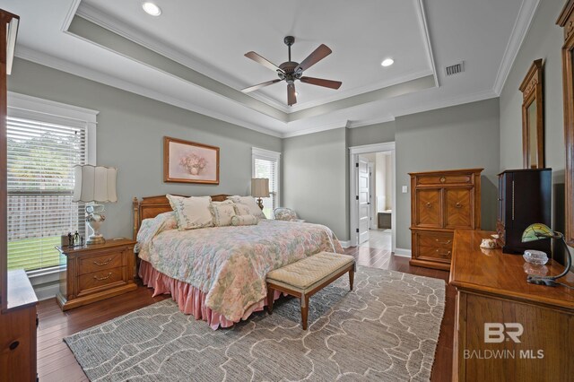 32035 Bobwhite Rd, Spanish Fort, AL 36527 - bedroom featuring a raised ceiling, dark wood-style floors, ornamental molding, recessed lighting, and baseboards