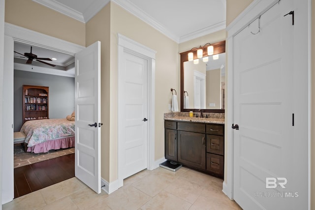 32035 Bobwhite Rd, Spanish Fort, AL 36527 - ensuite bathroom with ornamental molding, a ceiling fan, baseboards, tile patterned flooring, and vanity