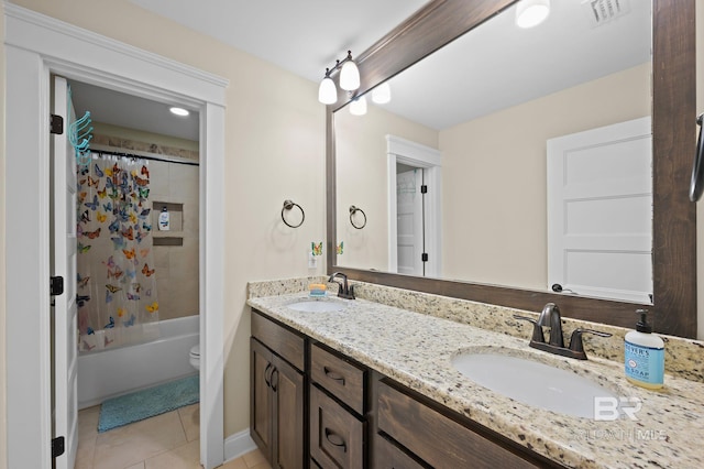 32035 Bobwhite Rd, Spanish Fort, AL 36527 - bathroom with tile patterned flooring, double vanity, shower / bath combo with shower curtain, and toilet