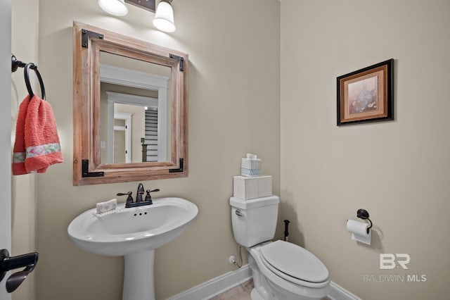 32035 Bobwhite Rd, Spanish Fort, AL 36527 - bathroom featuring baseboards and toilet