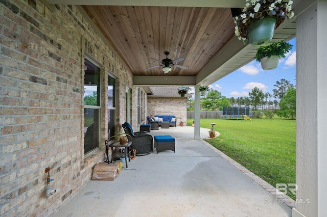 32035 Bobwhite Rd, Spanish Fort, AL 36527 - view of patio with a trampoline, ceiling fan, and outdoor lounge area