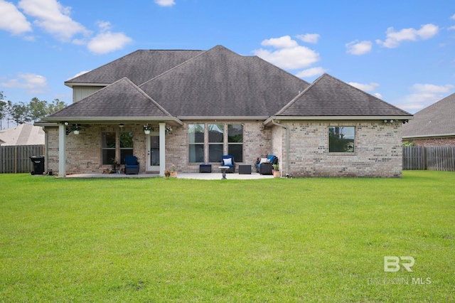 32035 Bobwhite Rd, Spanish Fort, AL 36527 - rear view of property with a shingled roof, a patio area, brick siding, and outdoor lounge area