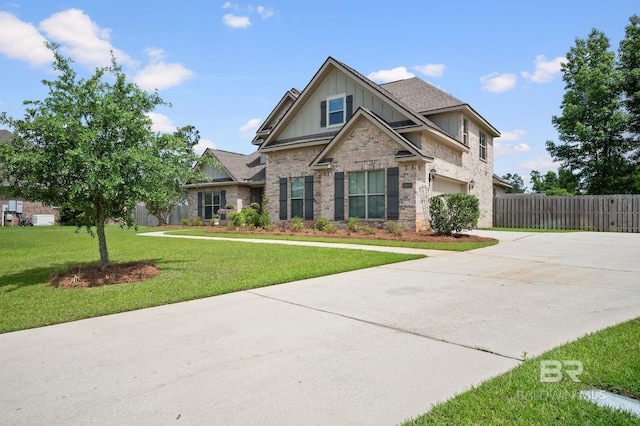 32035 Bobwhite Rd, Spanish Fort, AL 36527 - craftsman house featuring board and batten siding, driveway, a garage, and brick siding