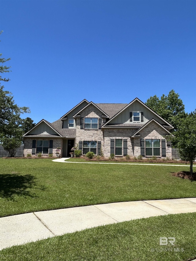 32035 Bobwhite Rd, Spanish Fort, AL 36527 - craftsman-style house featuring a front lawn, board and batten siding, and fence