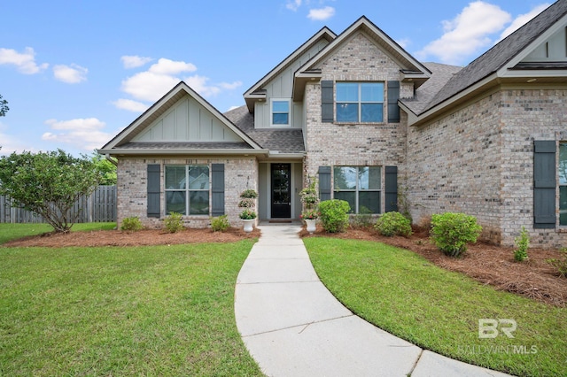32035 Bobwhite Rd, Spanish Fort, AL 36527 - view of front facade with board and batten siding, brick siding, and roof with shingles