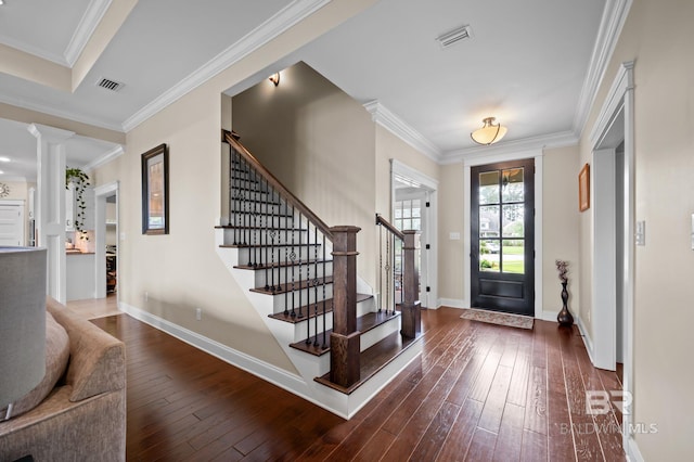 32035 Bobwhite Rd, Spanish Fort, AL 36527 - foyer entrance featuring stairs, crown molding, dark wood-style flooring, baseboards, and decorative columns