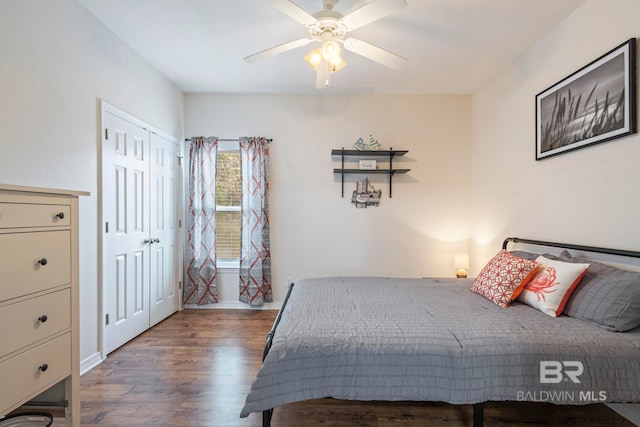 bedroom featuring dark hardwood / wood-style floors, a closet, and ceiling fan