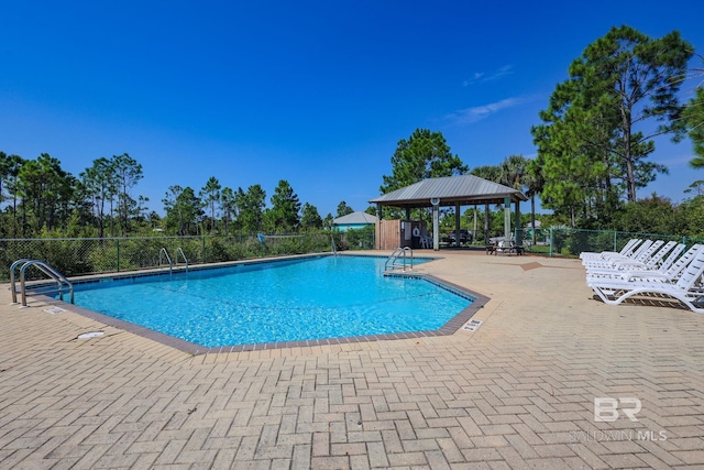 view of pool featuring a gazebo and a patio area