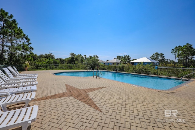 view of pool with a patio