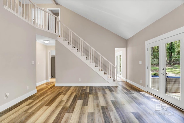 106 Gordon Cir, Daphne, AL 36526 - foyer entrance with high vaulted ceiling, stairway, wood finished floors, and french doors