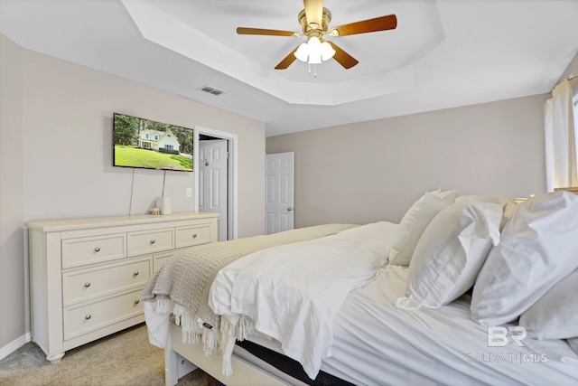106 Gordon Cir, Daphne, AL 36526 - bedroom featuring a tray ceiling, light colored carpet, and a ceiling fan