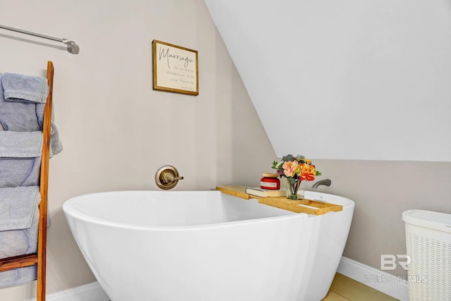 106 Gordon Cir, Daphne, AL 36526 - bathroom with a freestanding tub, vaulted ceiling, and tile patterned flooring
