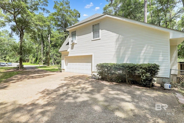 106 Gordon Cir, Daphne, AL 36526 - view of property exterior with a garage and asphalt driveway