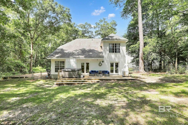 106 Gordon Cir, Daphne, AL 36526 - back of property with french doors, a hot tub, a wooden deck, a fenced backyard, and outdoor lounge area