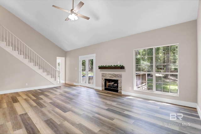106 Gordon Cir, Daphne, AL 36526 - unfurnished living room featuring stairs, ceiling fan, wood finished floors, a fireplace, and high vaulted ceiling
