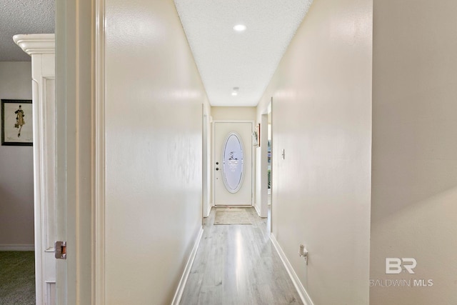 corridor featuring wood-type flooring