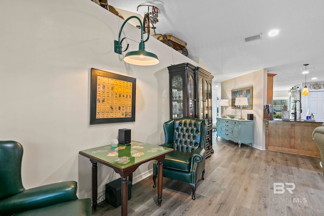 dining space with light hardwood / wood-style flooring