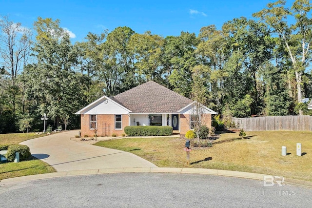 ranch-style home with a front lawn