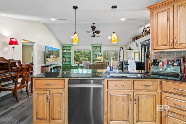 kitchen featuring a textured ceiling, sink, dishwasher, dark hardwood / wood-style floors, and lofted ceiling