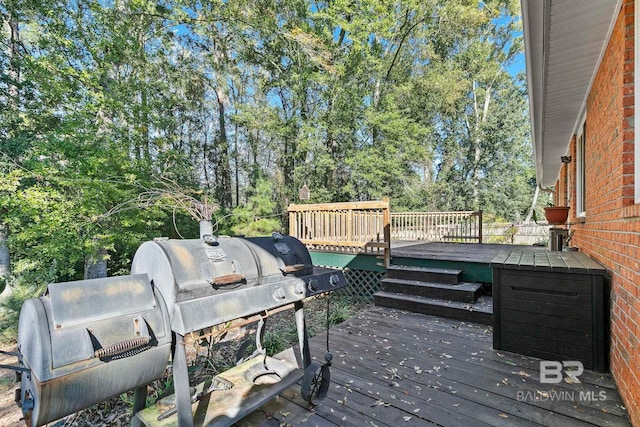 wooden deck with grilling area