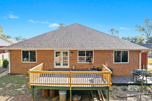 back of property featuring a wooden deck