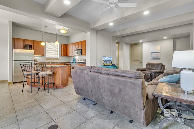 living area featuring ceiling fan, light tile patterned floors, and recessed lighting