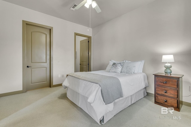 bedroom with baseboards, a ceiling fan, and light colored carpet