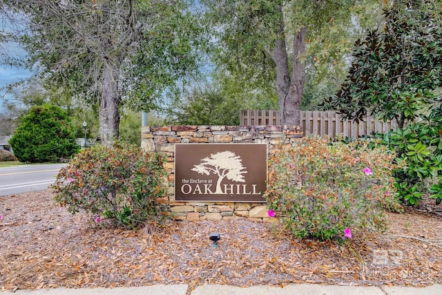 community sign with fence