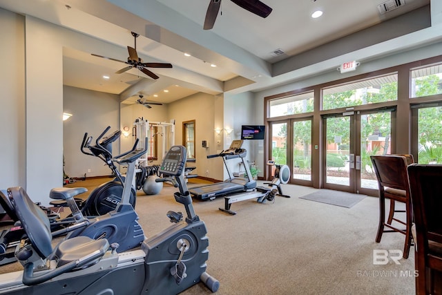 exercise room featuring recessed lighting, visible vents, and french doors