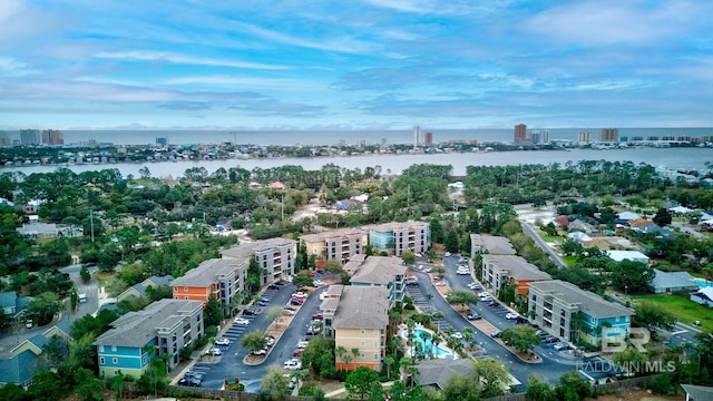 drone / aerial view featuring a water view and a city view