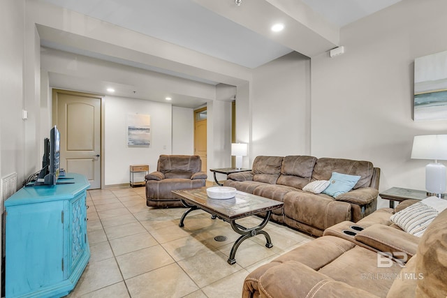 living area with baseboards, light tile patterned flooring, and recessed lighting