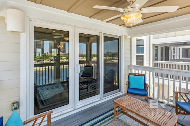 sunroom / solarium with ceiling fan