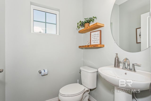 bathroom with toilet and sink