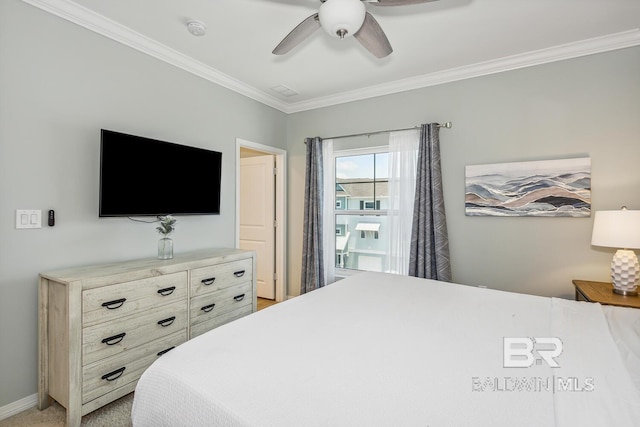 bedroom with carpet, ceiling fan, and ornamental molding