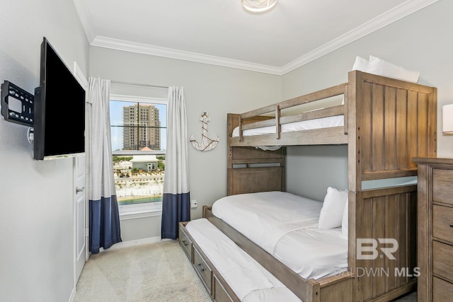 carpeted bedroom featuring ornamental molding and multiple windows