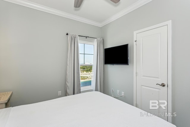 bedroom featuring ornamental molding and ceiling fan